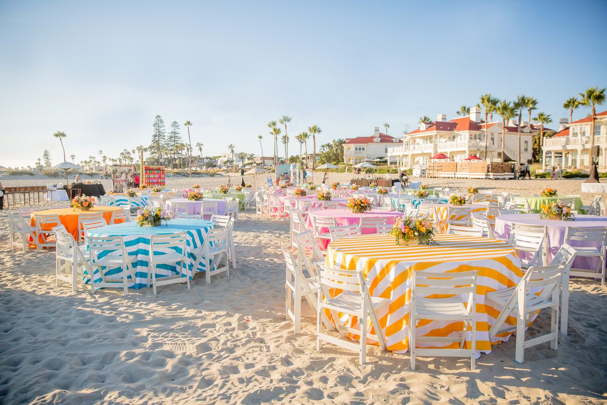 Event set-up with colorful tablecloths on the beach