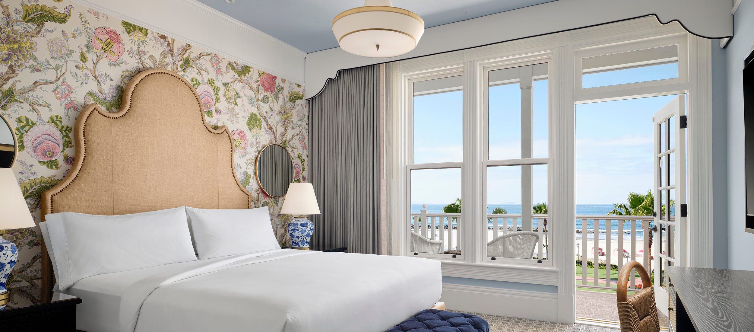 Oceanfront Victorian guest room with king bed and balcony